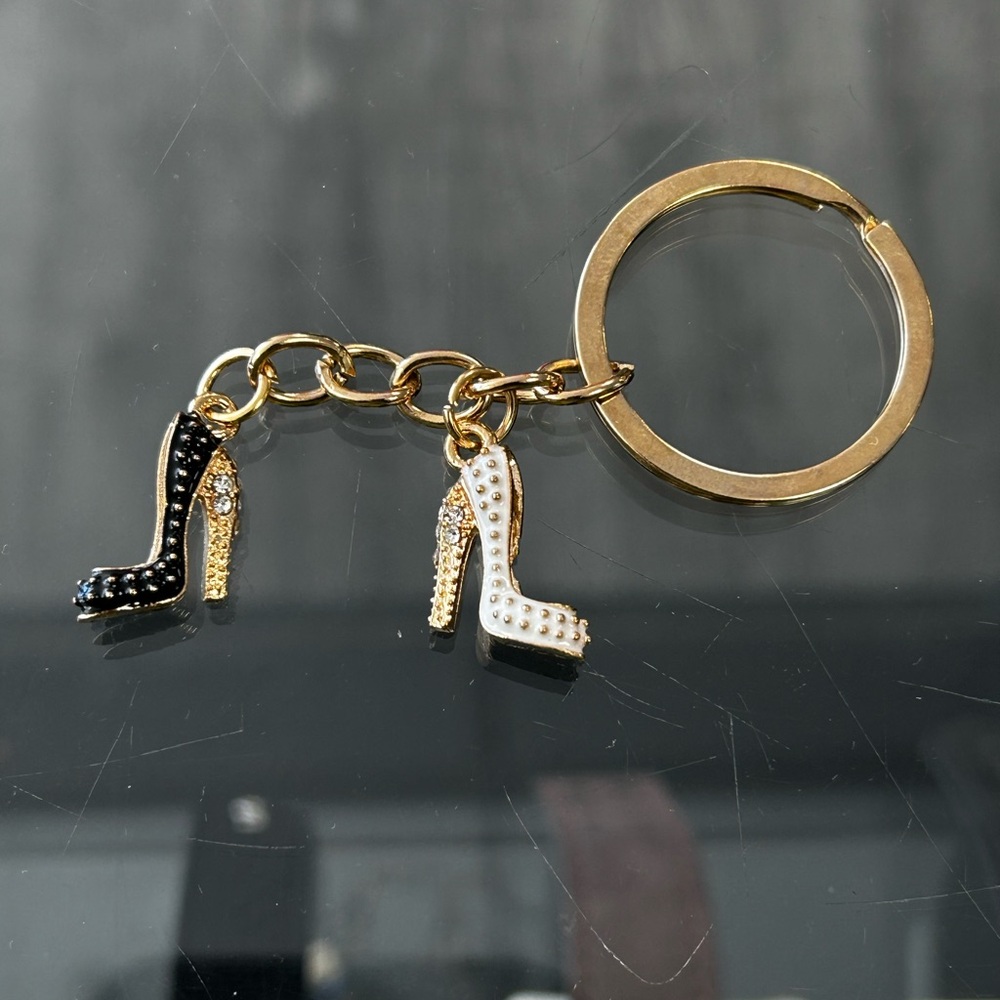 Elegant Gold Keychain with Black and White Shoe Charms